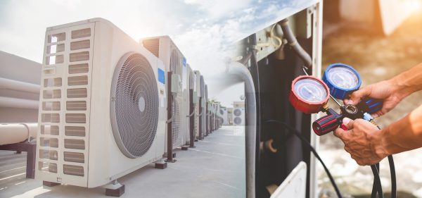 Air conditioning HVAC on the roof of an industrial building Being Serviced by HVAC Service Expert