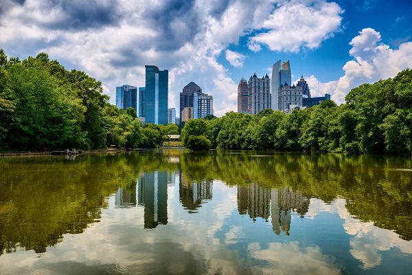 Skyline Behind Lake and Trees - Atlanta Geothermal Company