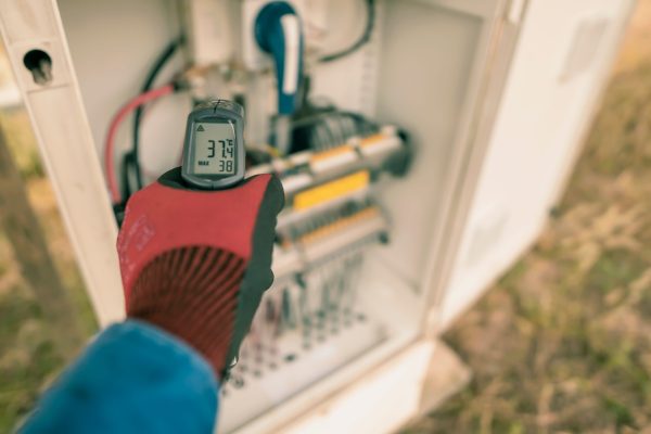 Engineering used an Infrared thermometer to measure the temperature of Commercial Residential HVAC Services Conventional And Geothermal Systems