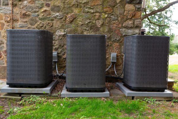 Multiple outdoor air conditioning units installed at a residential property in Buckhead, Atlanta, highlighting the importance of HVAC maintenance, system efficiency, and professional heating and air service before peak summer demand.