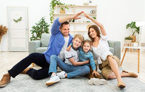 Family relaxing comfortably in a cool home after professional Atlanta AC repair and HVAC service.