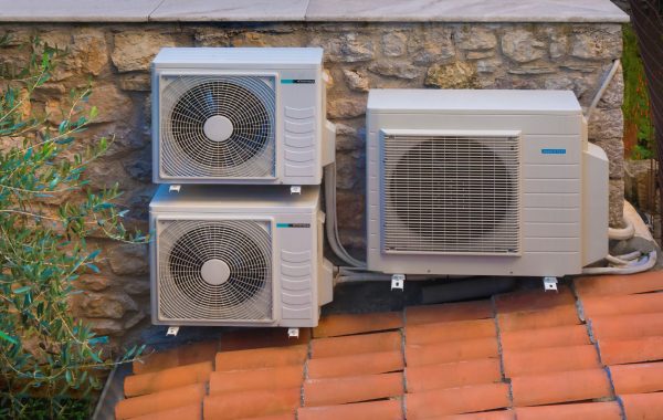 Outdoor air-source heat pump units at a home in Atlanta, GA, illustrating common HVAC cooling repair issues.