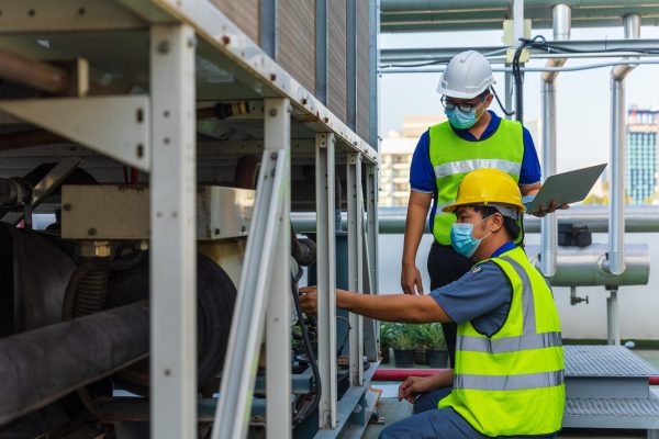 Atlanta Commercial HVAC technicians inspecting rooftop equipment during preventative maintenance in Atlanta