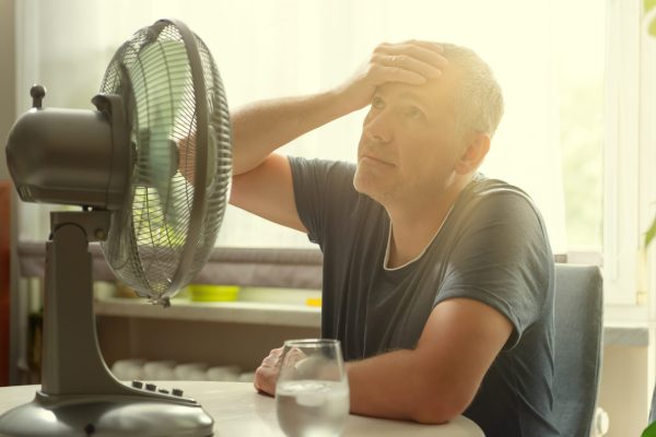Homeowner struggling with indoor heat while troubleshooting a GeoComfort geothermal heat pump cooling problem.