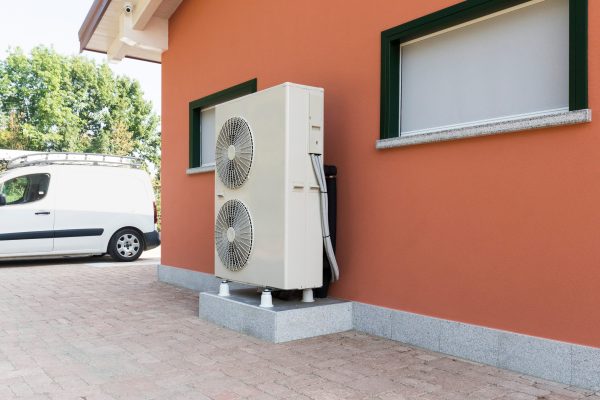 Outdoor heat pump cooling system beside a home, highlighting Atlanta HVAC service and cooling performance issues
