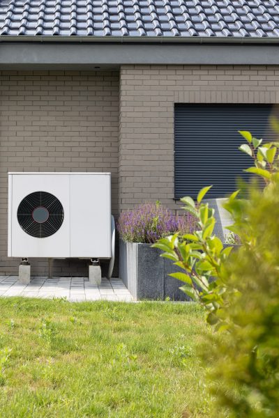Outdoor heat pump system at a home, highlighting HVAC maintenance and cooling performance in Atlanta.